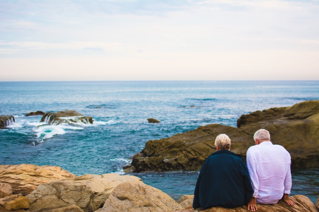 Should I Go To Therapy? 6 Reasons You Might Want To 15 married couple sitting by the ocean