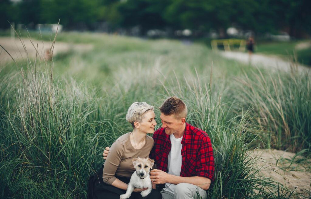 Couples Counselling Burnaby 1 happy couple in a field with their dog