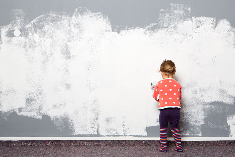permissive parenting - a child painting the wall