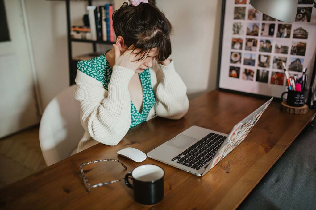 Generalized Anxiety Disorder (GAD) 1 woman with generalized anxiety disorder sitting at her desk